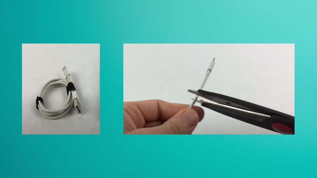 cutting iPhone charger cable with scissors