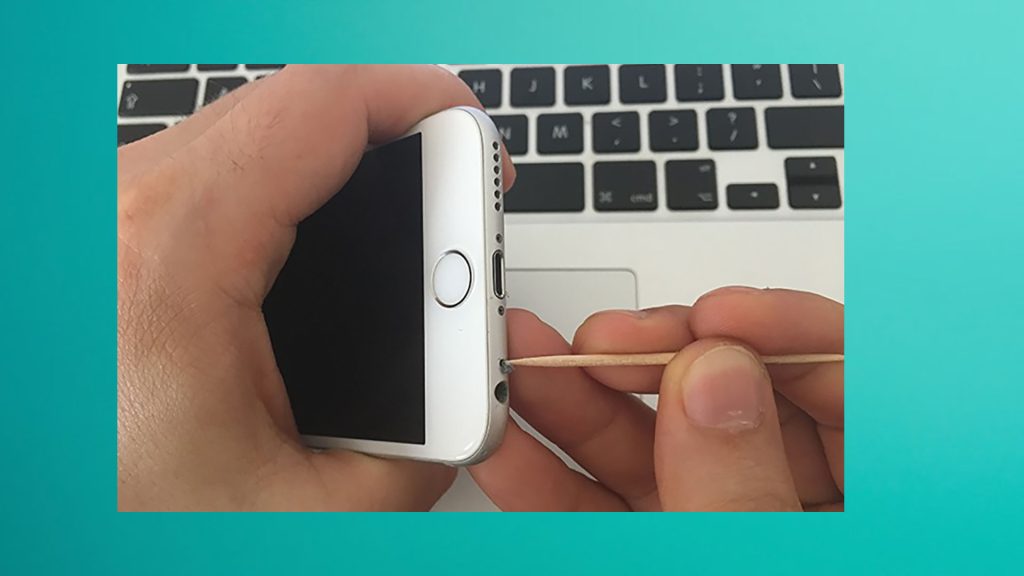 clean iPhone microphone using a toothpick